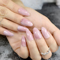 Hand with pink nail polish on a neutral background, Obroi