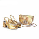 Gold high-heeled shoes with embellishments and a matching handbag on a white background, Obroi