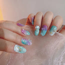 Multicolored nail art with glitter and decorations on a light background, Obroi