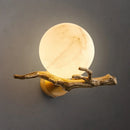 Wall-mounted light fixture with natural wood branch design on a dark background, Obroi