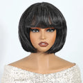 Black bob wig on a mannequin head with a plain background, Obroi
