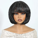 Black bob wig on a mannequin head with a plain background, Obroi