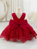 Red lace dress with a large bow on a mannequin against a white background, Obroi