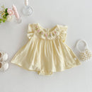 Yellow baby dress with floral embroidery on a light gray background, Obroi