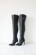 Pair of black knee-high boots on a white background, Obroi