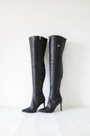 Pair of black knee-high boots on a white background, Obroi
