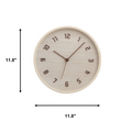 A round wall clock with a light beige textured face and frame, dark brown numerals and hands, shown on a white background with black dimension arrows labeled 11.8 inches wide and tall, Obroi