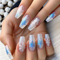 Nails with snowflake design on a light background, Obroi