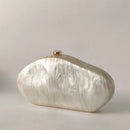 Marble-textured clutch bag with gold clasp on a light gray background, Obroi