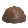 Brown leather cap on a white background, Obroi