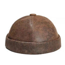 Brown leather cap on a white background, Obroi