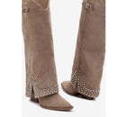 Brown suede boots with decorative studs on a white background, Obroi