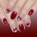 Nails with red polish and cherry designs on a red background, Obroi
