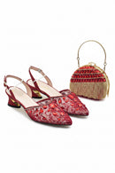 Red embellished shoes with a matching handbag on a white background, Obroi