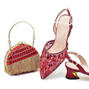 Red embellished shoes and handbag on a white background, Obroi