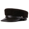 Black leather cap with a button on a white background, Obroi