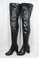 Black leather knee-high boots on a white background, Obroi