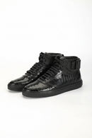 Pair of black leather boots on a white background, Obroi