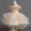 Beige flower girl dress on a mannequin against a dark background, Obroi
