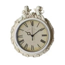 Decorative wall clock with cherub figures on a white background, Obroi