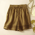 Brown shorts with lace trim on a light beige , Obroi