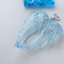 Obroi Blue angel wing charm with a silver hook on a white background