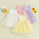 Four children's dresses in white, pink, yellow, and purple with floral patterns on a beige background, Obroi