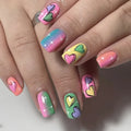 Nails with colorful heart designs on a neutral background, Obroi