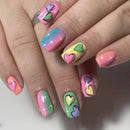 Nails with colorful heart designs on a neutral background, Obroi