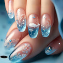 Nails with whale and floral design on a blue background