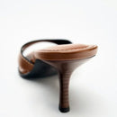 Brown high-heeled shoe on a white background, Obroi