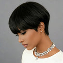 Woman with a stylish short black haircut wearing a white top and pearl necklace on a gray background, Obroi