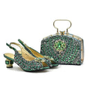 A matching formalwear set featuring a pair of green embellished slingback heels and a structured green clutch handbag with gold-tone hardware, photographed on a clean white background, Obroi