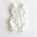 White baby romper with ruffled details on a white background, Obroi