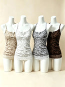 Four women's camisole-style lingerie pieces with leopard print are displayed on white mannequin torsos against a warm beige studio background. The colors shown are beige/tan, white, gray, and dark brown, Obroi