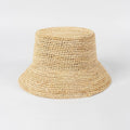 Beige woven bucket hat on a light gray background, Obroi