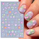 Pastel nail art stickers with flowers, stars, and bows on a sheet and applied to nails, Obroi