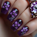 Nails with purple floral design and white accents on a dark background, Obroi