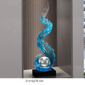 Obroi decorative sculpture with blue wave design on a gray background