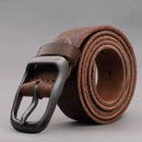 Obroi Brown leather belt with a silver buckle on a gray background