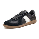 Black and gray sneaker with a white stripe on a white background, Obroi