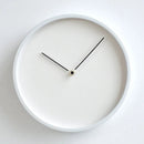 White wall clock with black hands on a white background, Obroi