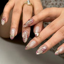 Close-up of hands with decorative nail art on a neutral background, Obroi