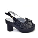 Black high-heeled shoe with rhinestone details on a white background, Obroi