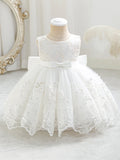 White lace dress on a mannequin with a decorative background, Obroi