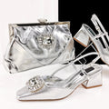 Silver clutch and shoes with gemstone embellishments on a white background, featuring the brand 'Obroi'.