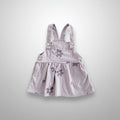 Striped pinafore dress with floral embroidery on a white background, Obroi