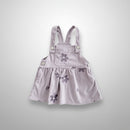 Striped pinafore dress with floral embroidery on a white background, Obroi