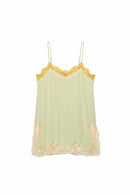 A pale sage green sheer camisole with yellow lace trim at the neckline and beige lace trim at the hem, featuring thin metal spaghetti straps, Obroi