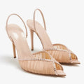 Pair of high-heeled shoes with embellishments on a white background, Obroi